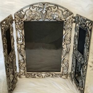 Baroque style trifold photo frame.